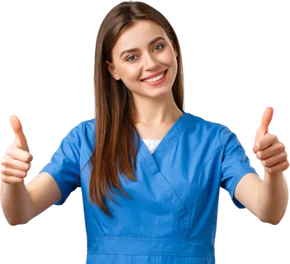 A happy aesthetic student in blue medical scrubs giving a thumbs-up after completing an aesthetic course in Birmingham.